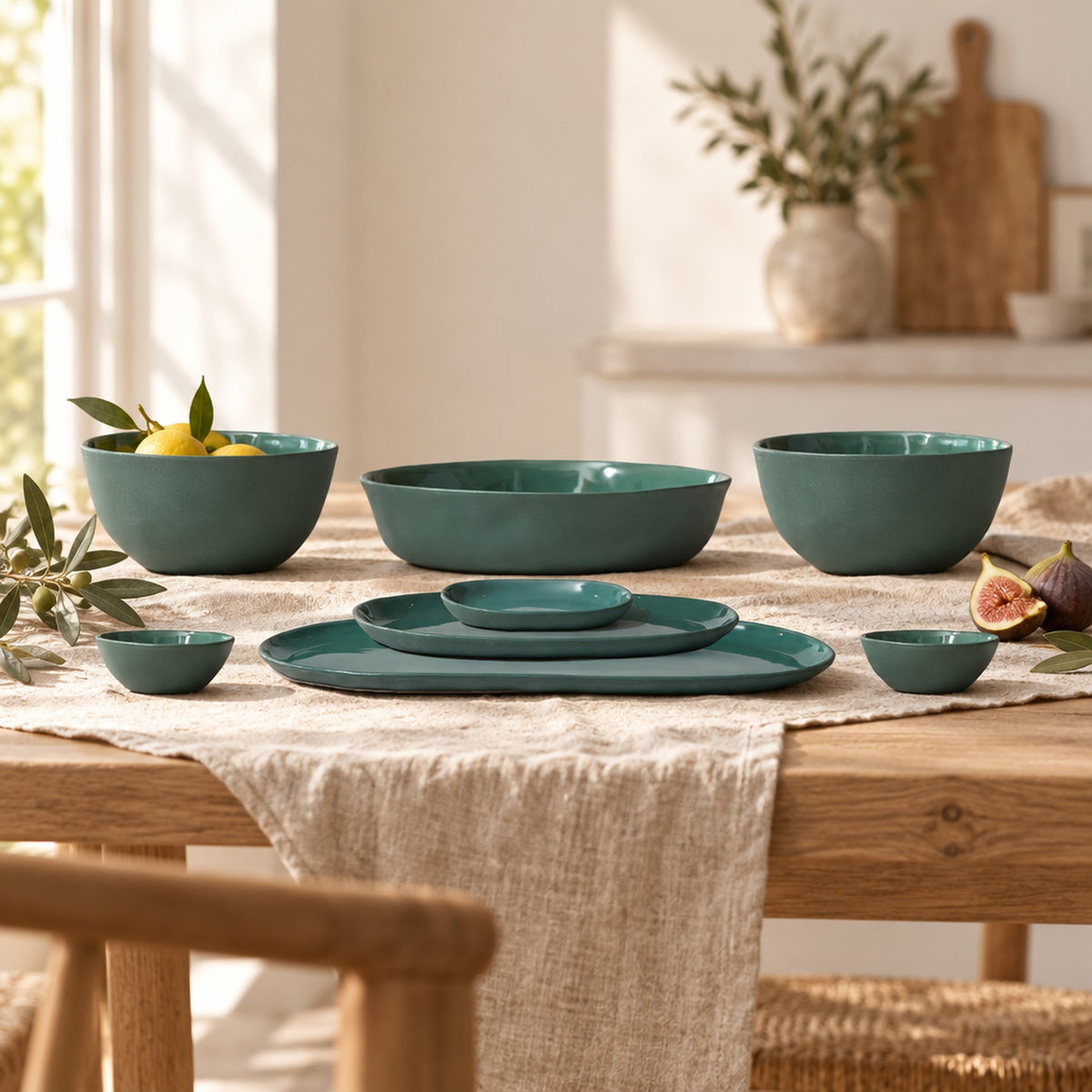 Cloud Value Set Moss styled on an oak dining table with linen, olive leaves and fruit